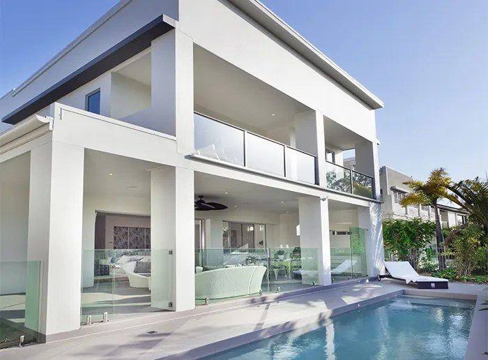 Poolside home with open-plan glazing to the terrace